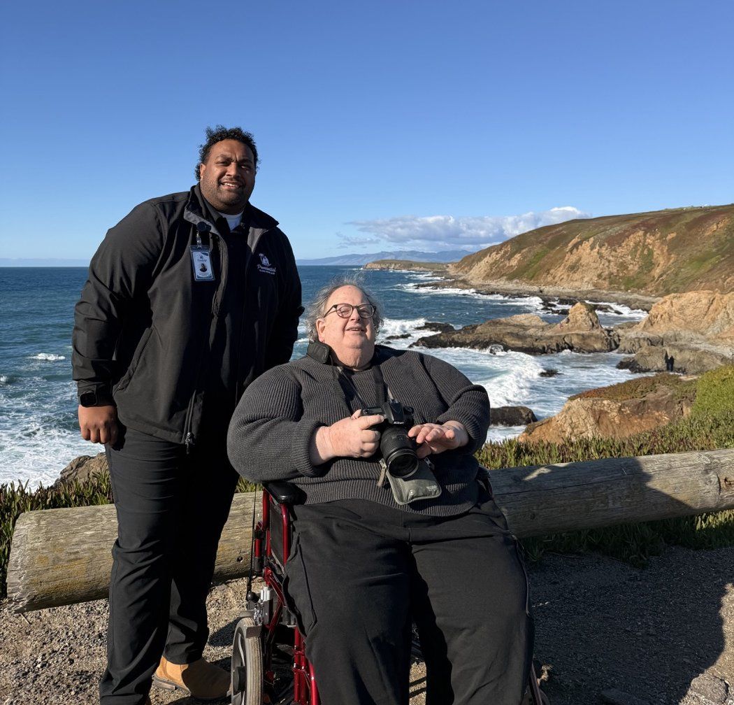 A Providential Fijian Home Care caregiver on an outing with a client along the Sonoma coast